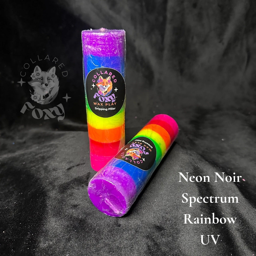 Spectrum rainbow striped UV reactive paraffin dripping pillar candles on black velvet with Neon Noir label