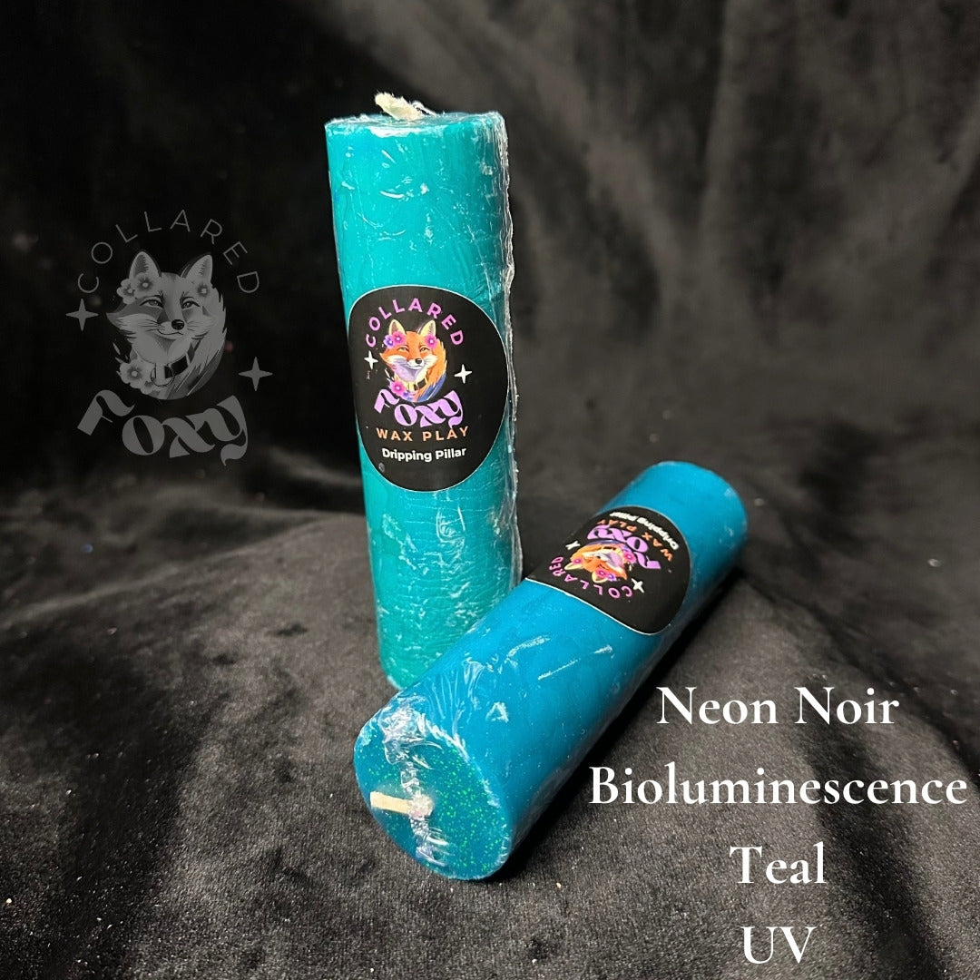 Bioluminescence teal UV reactive paraffin dripping pillar candles on black velvet with Neon Noir label