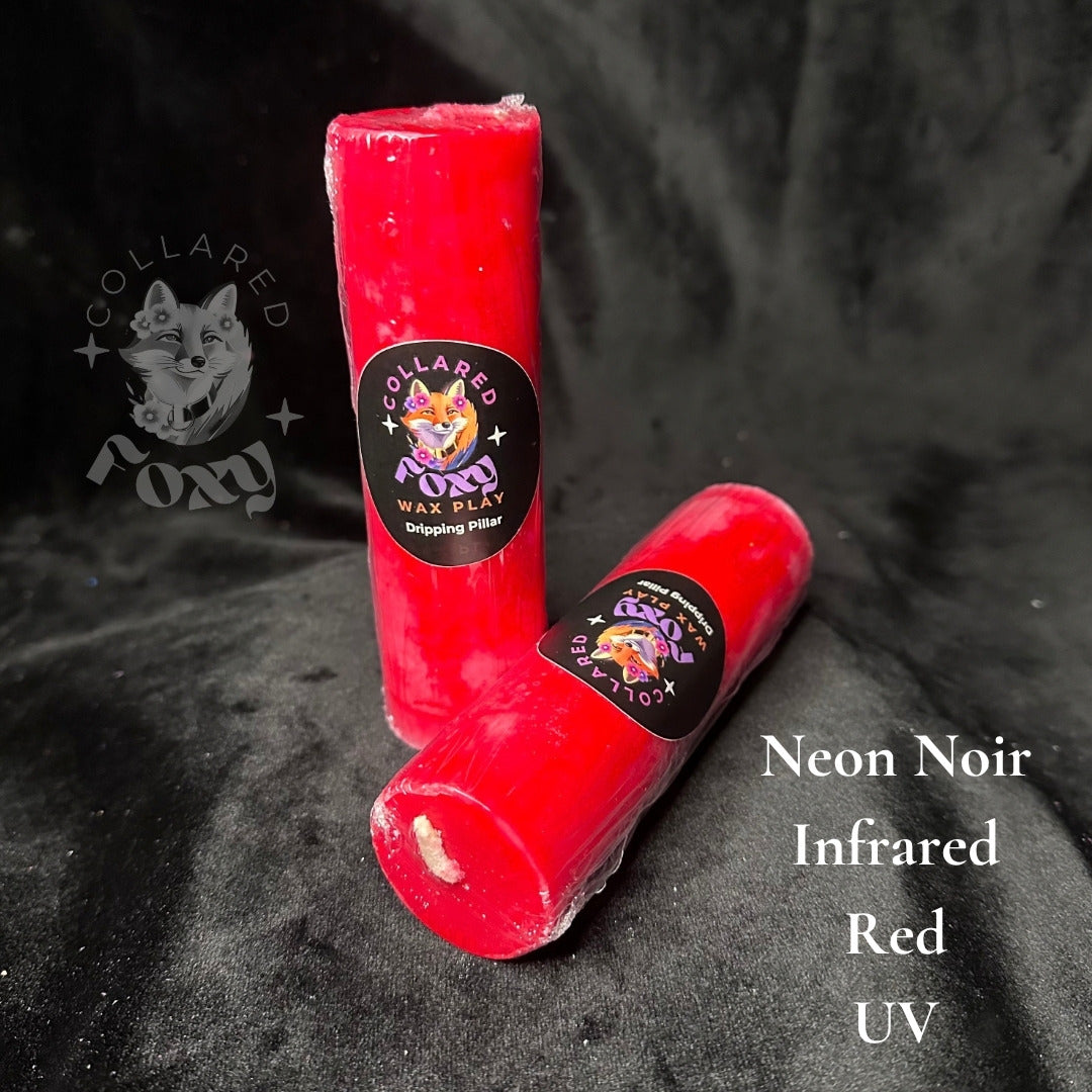 Infrared red UV reactive paraffin dripping pillar candles on black velvet with Neon Noir label
