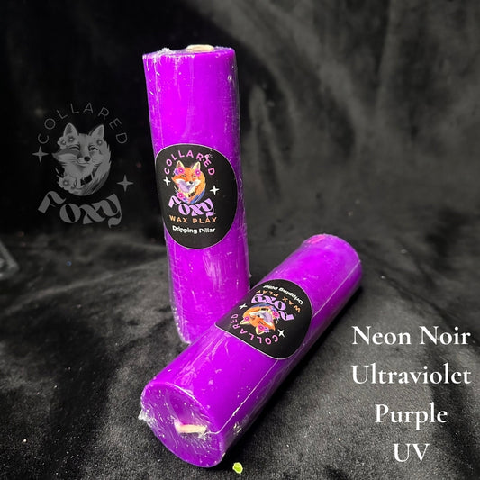 Ultraviolet purple UV reactive paraffin dripping pillar candles on black velvet with Neon Noir label