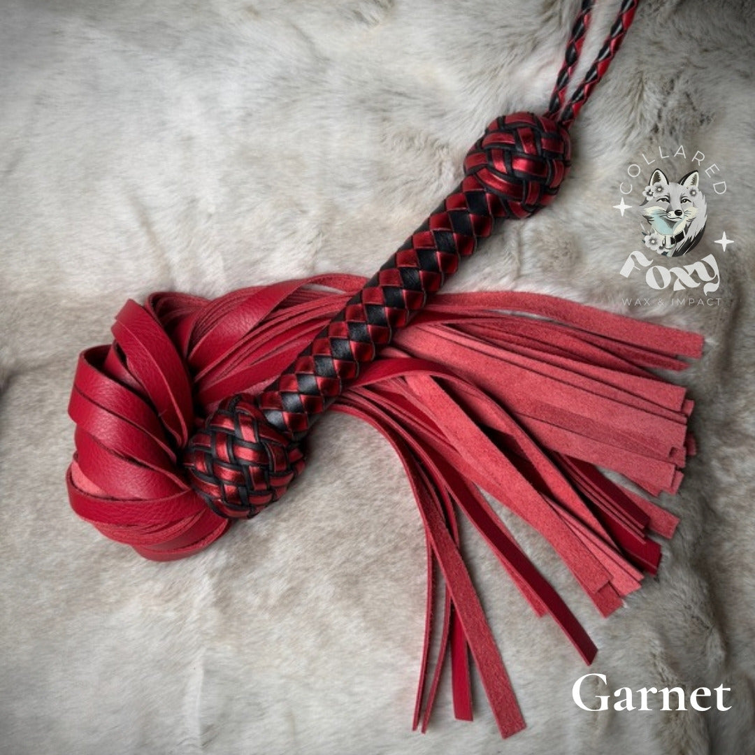 Garnet flogger, red falls with red and black braided handle