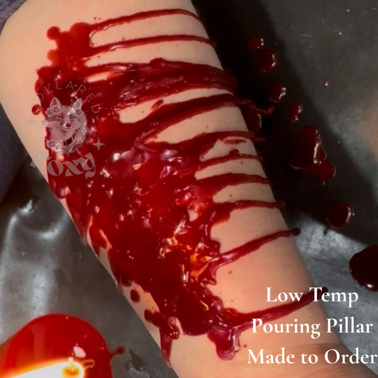 Red Low Temp pouring pillar wax pooled and dripping across a forearm, made to order