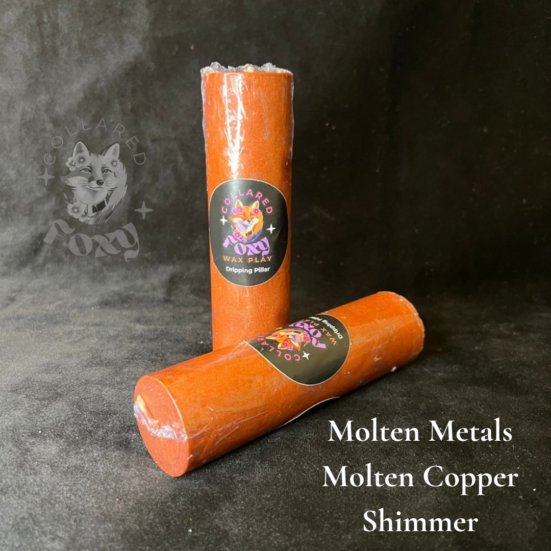 Molten Copper shimmer wax play candles, labelled, on black velvet