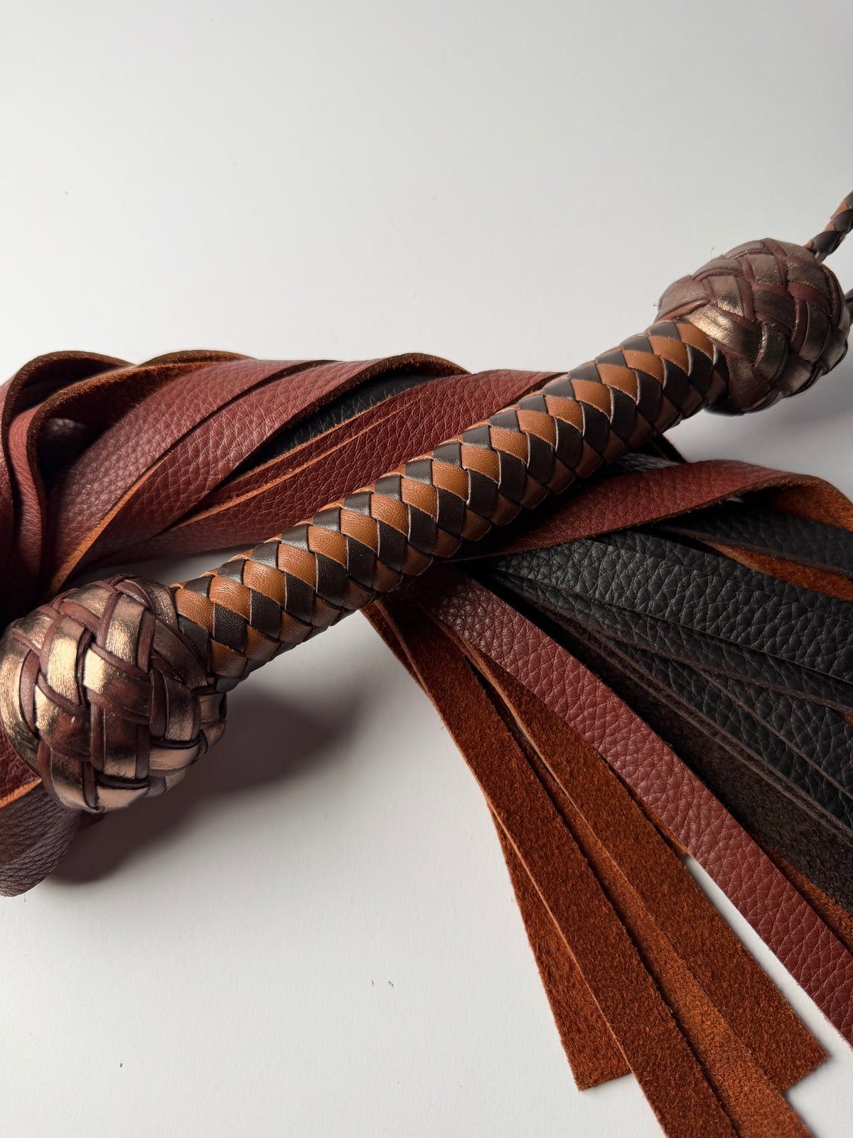 Oloroso chocolate and tan braided handle between two metallic bronze Turk's head knots