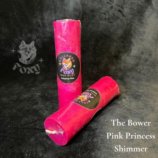 Pink Princess fuchsia shimmer wax play candles, labelled, on black velvet