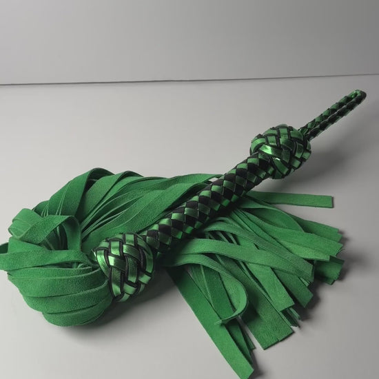 Video of the Peridot flogger, green cowhide suede with a metallic green and black braided handle