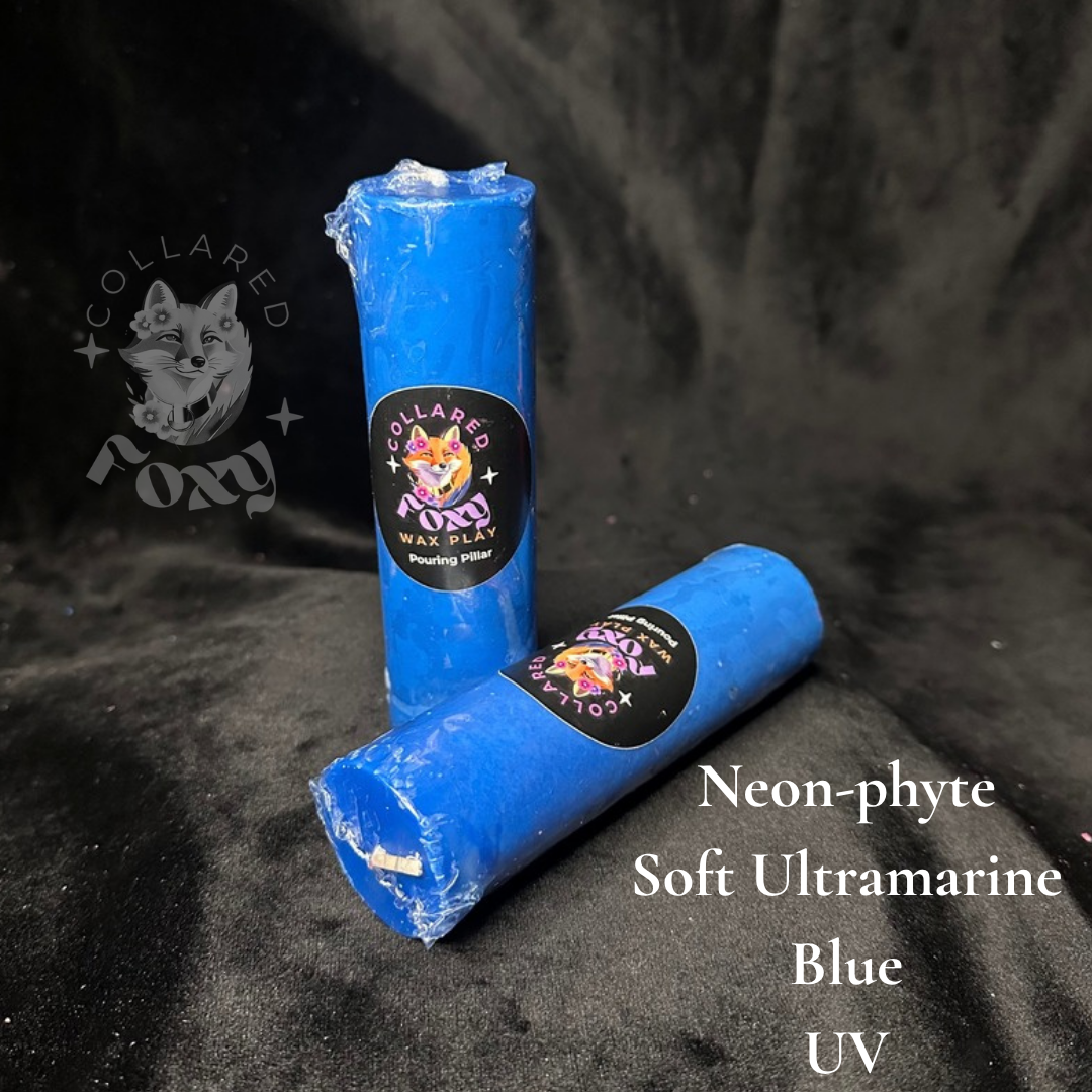 Soft Ultramarine blue Neon-phyte pouring pillar candles on black velvet with Neon-phyte label